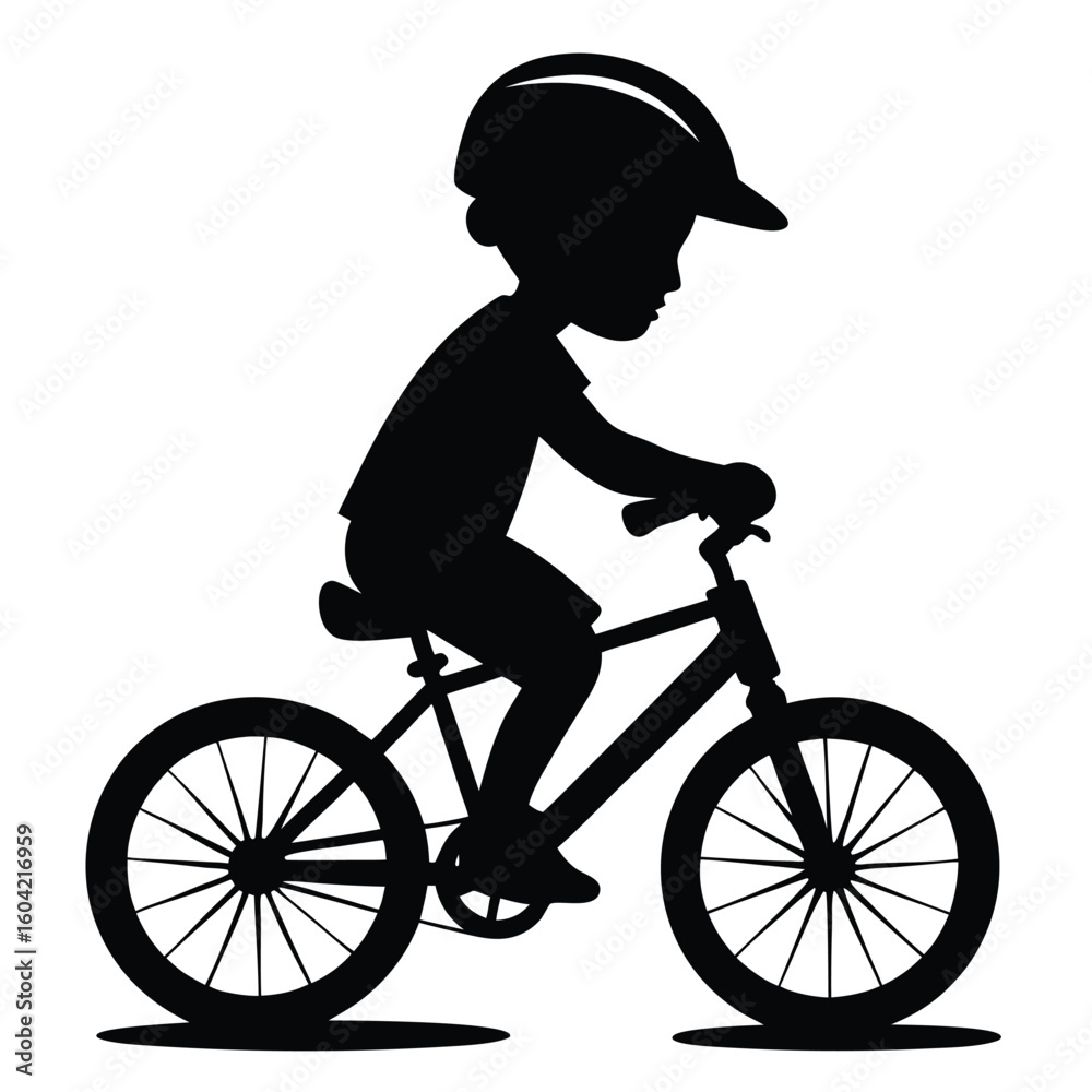 Fototapeta premium Child Riding a Bicycle in Silhouette