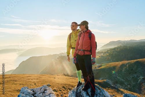 Couple in Love Enjoying the View at the Top of a Mountain.