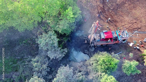 Aerial View of Borewell Drilling Site in Green Woodland