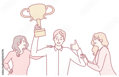A joyful celebration unfolds as one person proudly holds a trophy with others cheering and supporting enthusiastically