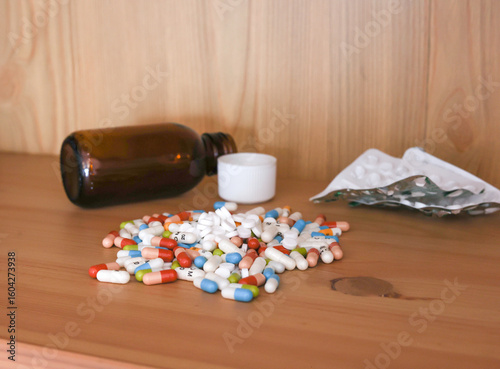 pills and tablets with bottle on side and blister pack