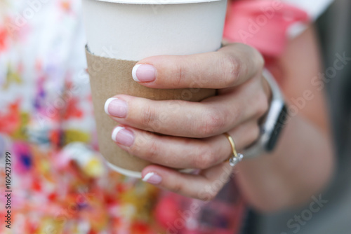 woman holding a cup of coffee