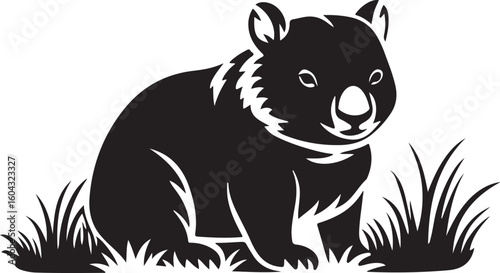 Cute baby wombat sitting peacefully in green grass isolated on transparent background