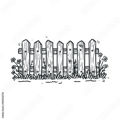Rustic wooden fence with flowers and grass in a garden setting