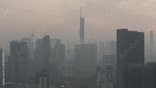 Aerial view cinematic establishing shoot of Kuala Lumpur city center view at sunrise dawn overlooking the city skyline