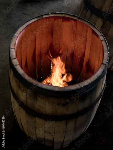 A whisky barrel being charred for storage