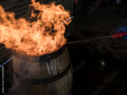 A whisky barrel being charred for storage
