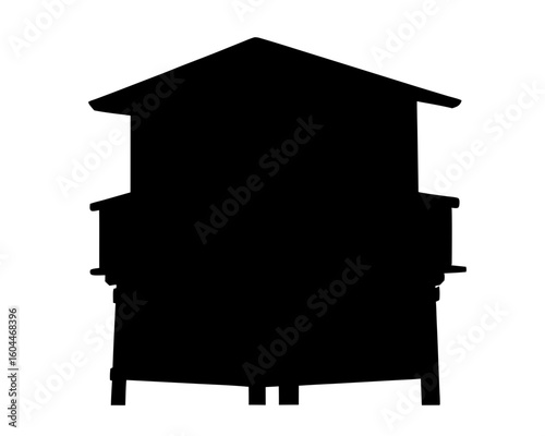 Silhouette of a two story wooden guard tower or observation structure