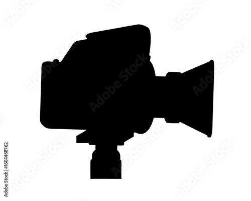 A Silhouette of an Old Professional Film Camera on its Tripod Stand