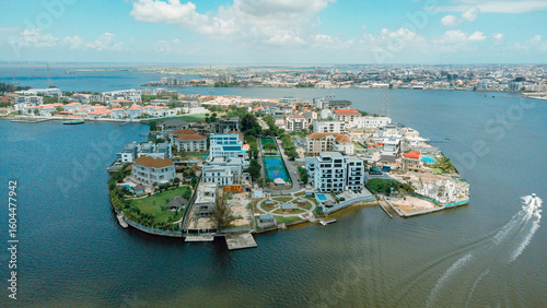 Aerial view of an exclusive island community with modern homes surrounded by the shimmering waters of Lagos Lagoon, a tranquil oasis, Lagos, Lagos, Nigeria.