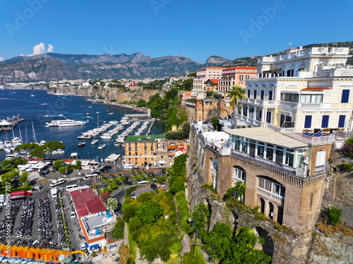 Fototapeta Naklejka Na Ścianę i Meble -  Sorrento. Amalfi coast. Italy. Drone view of Sorrento. View from above. Buildings and landmarks of Sorrento. Boats and yachts. Port of Sorrento. High-resolution photos.