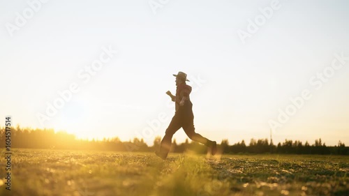 Wallpaper Mural Carefree farmer running in picturesque farmland in summer, cinematic slow motion . Good mood and positivity, enjoy simple life in countryside, happy farm worker admiring beautiful scenery and sunshine Torontodigital.ca