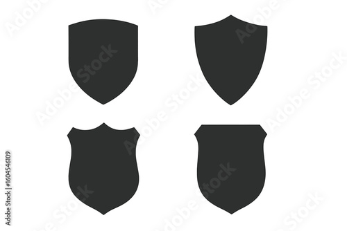 Set of 4 protective shields. Knightly military shield insignia of different shapes. Vector element for security logo, emblem, icon. Flat black silhouette collection.