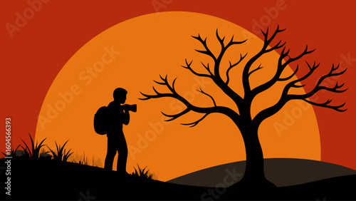 silhouette photographer holding camera