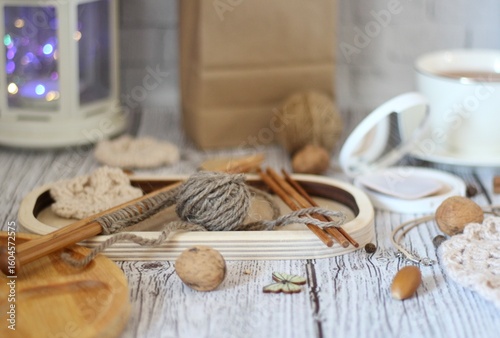  Woman's different things cup of tea, make up, ball clew yarn, mirror doily cozy photo beige pastel light colors