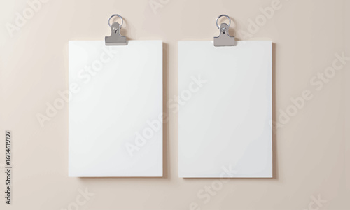 Minimalist White Papers with Silver Clips on Beige Wall