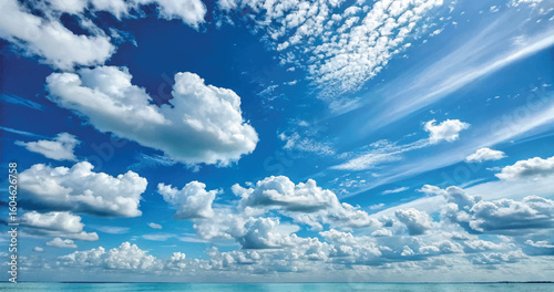 Stunning blue sky with fluffy white clouds and atmospheric textured background