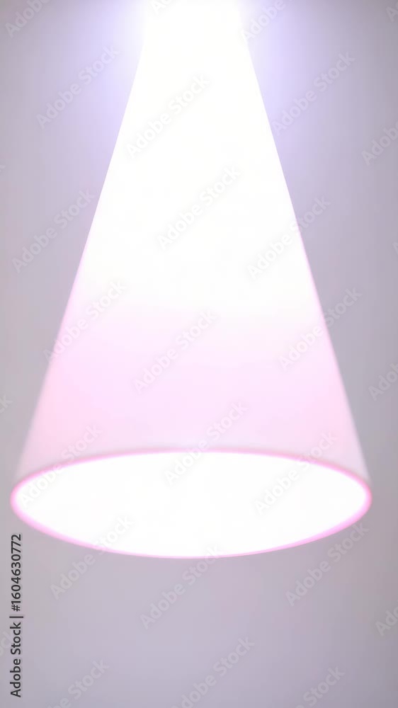 An upward perspective unveils a modern minimalist pendant light radiating a soft pink hue, casting a gentle glow. The architectural design accentuates the clean lines of a contemporary interior space. An upward perspective unveils a modern minimalist pendant light radiating a soft pink hue, casting a gentle glow. The architectural design accentuates the clean lines of a contemporary interior space.