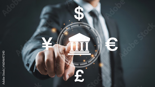 Businessman confidently interacts with global currency symbols and bank icon, symbolizing financial success and investment opportunities in a modern digital world.