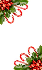 Vertical corner border of red candy canes, holly leaves, and Christmas bows on transparent background for holiday greeting card, invitation, or festive seasonal template design
