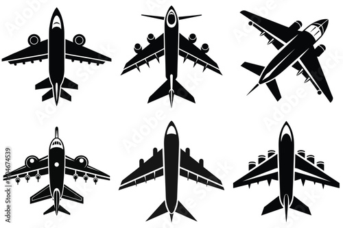 Aviation Array: An eye-level, black and white photo depicts an array of various airplane silhouettes, offering a diverse look at different aircraft from a unique perspective.