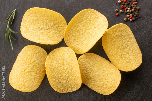 Crispy potato chips, top view, macro.
