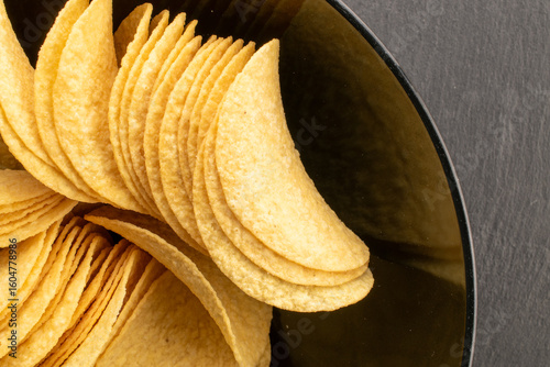 Crispy potato chips, top view, macro.