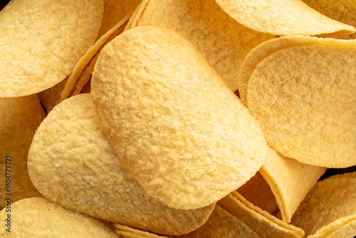 Crispy potato chips, top view, macro.