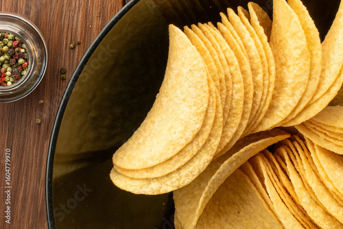 Crispy potato chips, top view, macro.