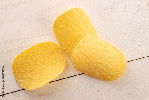 Crispy potato chips, top view, macro.