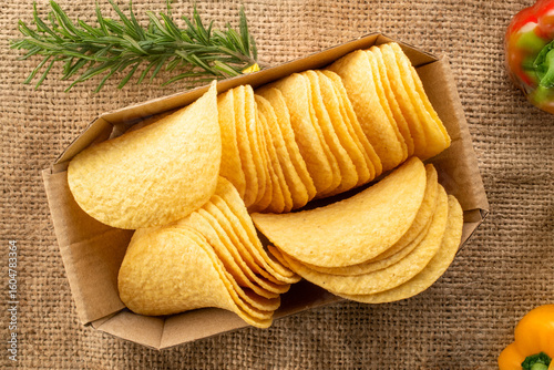 Crispy potato chips, top view, macro.