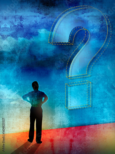 Man looking up at question mark in sky