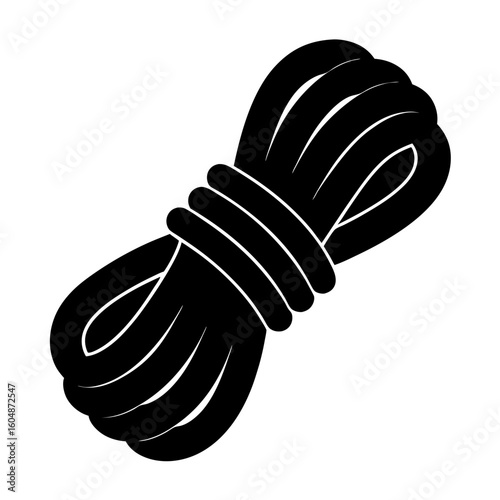 Black and white rope coiled tightly ready for use on adventure