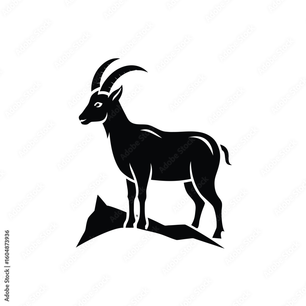 Fototapeta premium Silhouette a mountain goat standing on rocks animal