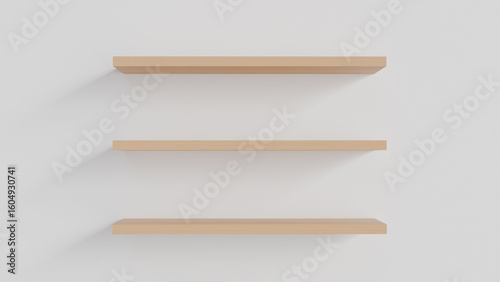 Three wooden wall shelves in the interior on a white background as a template for placing goods, decorative elements, cosmetics or design