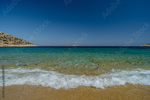 View of the breathtaking turquoise beach of Agia Theodoti in Ios Greece
