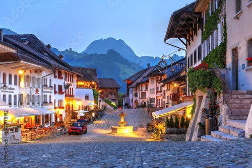 Rue du Bourg in Gruyeres village, Switzerland with a view of Moleson