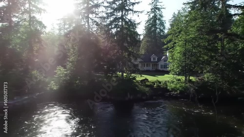 Riverfront home nestled in a lush forest
