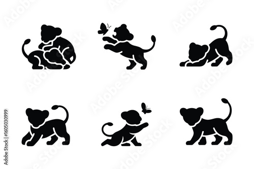 Playful lion cubs interacting with butterflies playing interaction