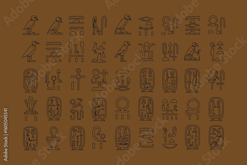Ancient egyptian hieroglyphs alphabet symbols on brown background
