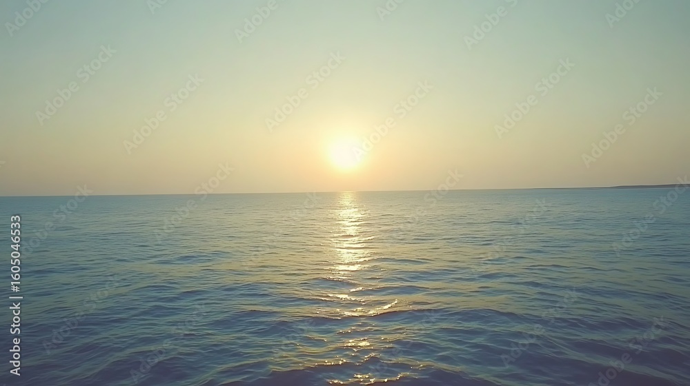 Obraz premium Tranquil sunset over the ocean