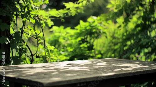 Outdoor wooden table with lush green foliage