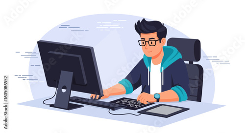Creative Young Man Works On His Computer Sitting At His Desk In A Modern Office