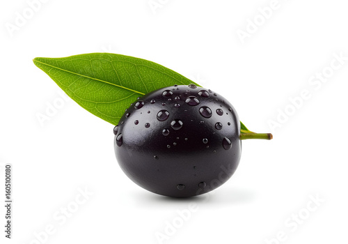 Dark purple jamun plum with green leaf and water droplets