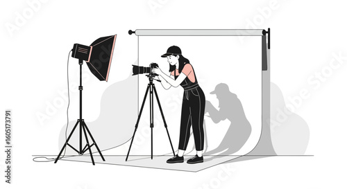 Professional Photographer Setting Up Equipment In Studio For A Photo Shoot