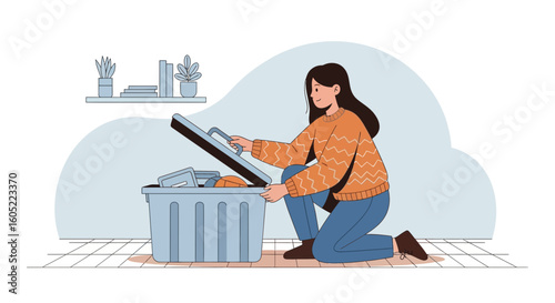 Woman On Her Knees Opening Plastic Container To Store Seasonal Decorations