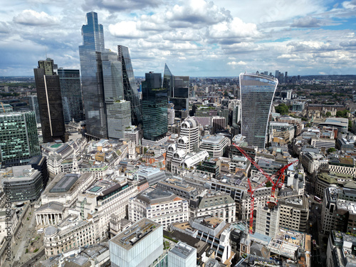 A construction site dominated by cranes, emphasizing growth and the evolution of the urban landscape in modern cities in London, UK. City of London.
