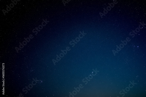 Deep Blue Night Sky: Starry, Serene, and Peaceful Nighttime Background Image