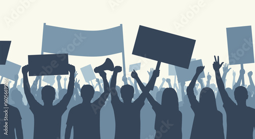 A large group of people holding signs and raising their fists in the air during a protest rally