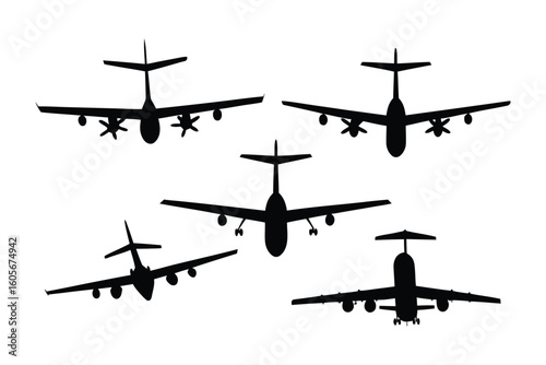 Airborne Silhouettes: Five aircraft silhouettes in flight, capturing the essence of aviation against the backdrop of the sky, the image focuses on shape and form of planes.